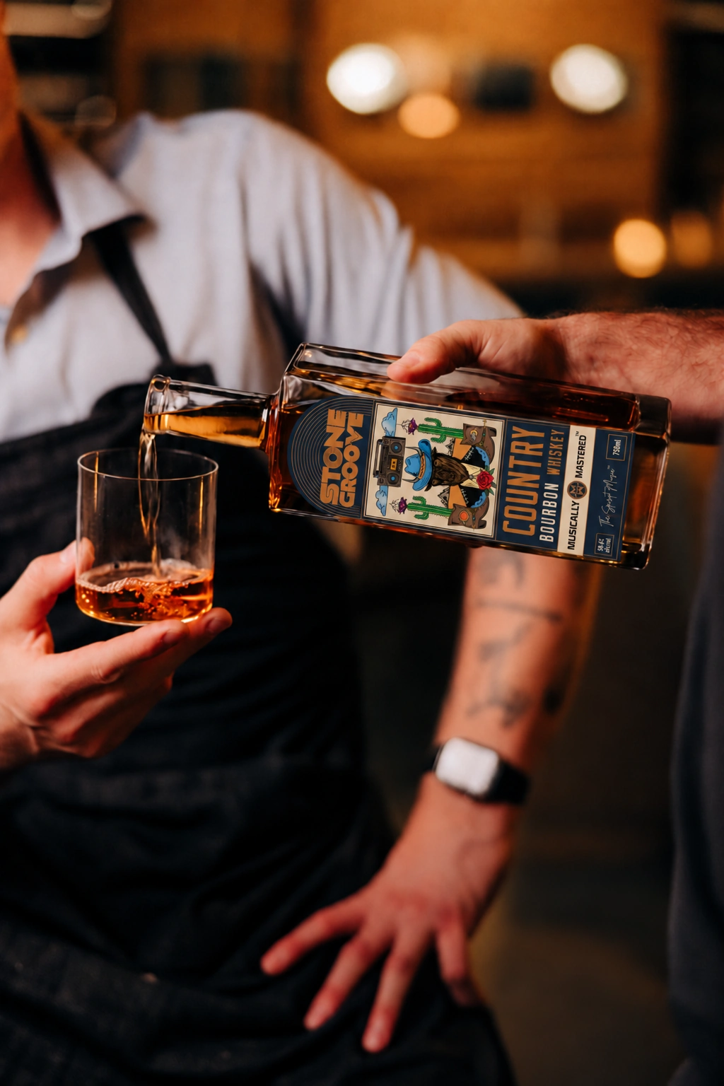A glass of Stone Groove Country Bourbon being poured